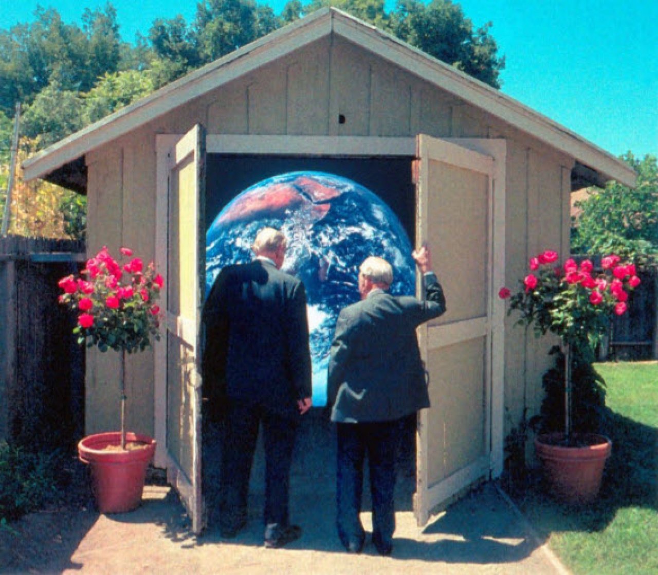 People opening a garage revealing the Earth.